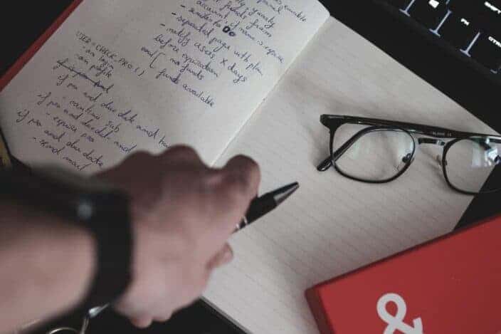 eyeglasses on white notebook