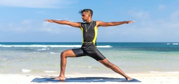 Man in Sleeveless Wetsuit Doing Some Aerobics