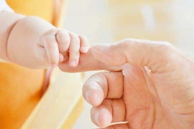 Person Touching Hand of Baby - preparing for fatherhood