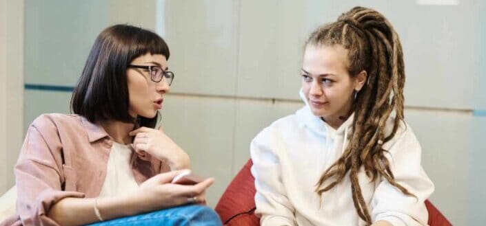 Women Talking While Sitting