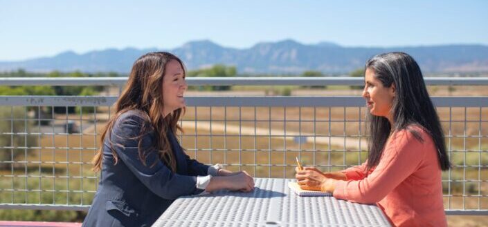 Two women having a meeting outside