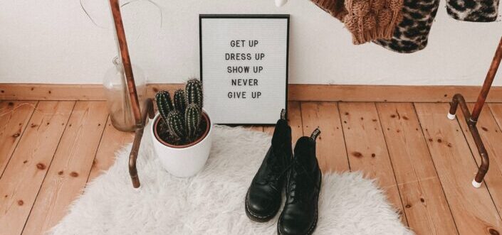 Rustic set-up display of fashion quote on the floor.