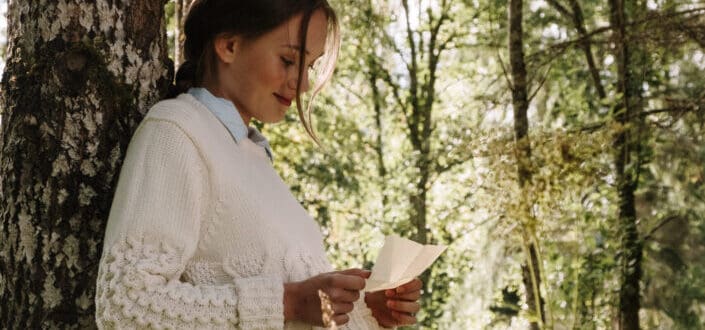 happy woman reading a letter 