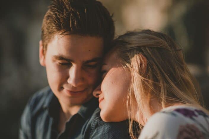 Woman sweetly leaning on her man