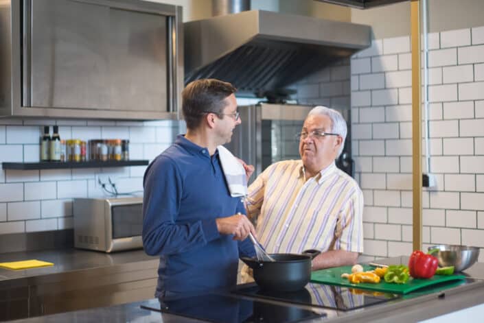 men talking in the kitchen