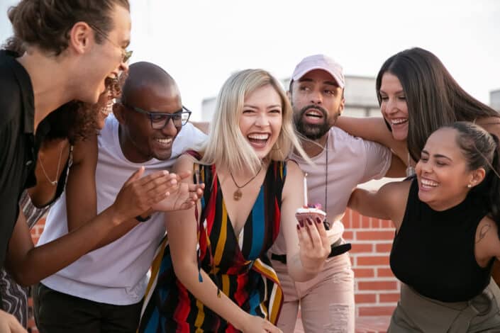 multiracial group of friends laughing together