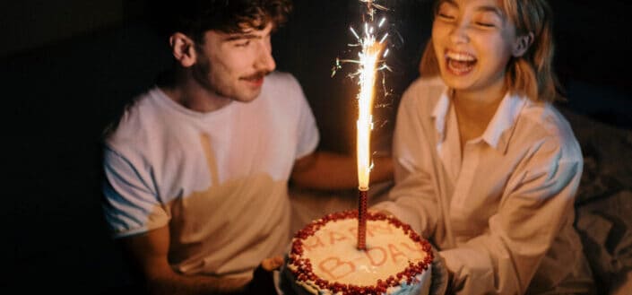 couple celebrating birthday at exactly 12.