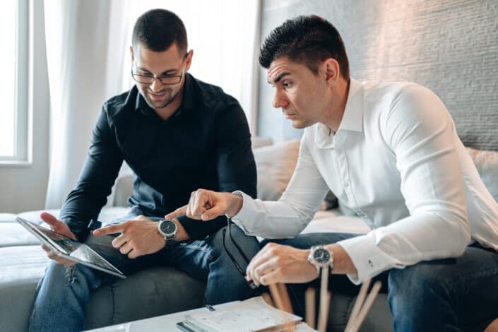 men looking at the gadget