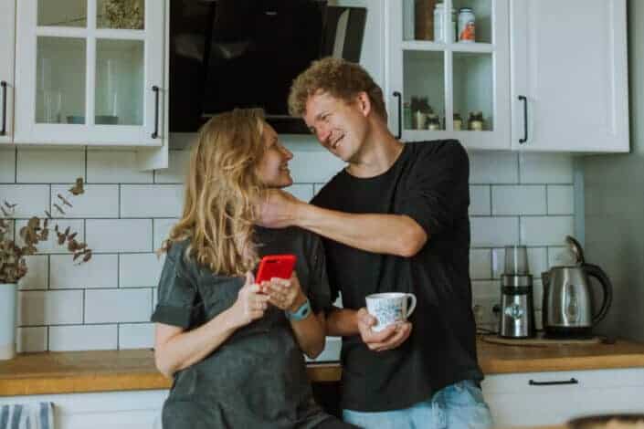 Couple being sweet while in their kitchen