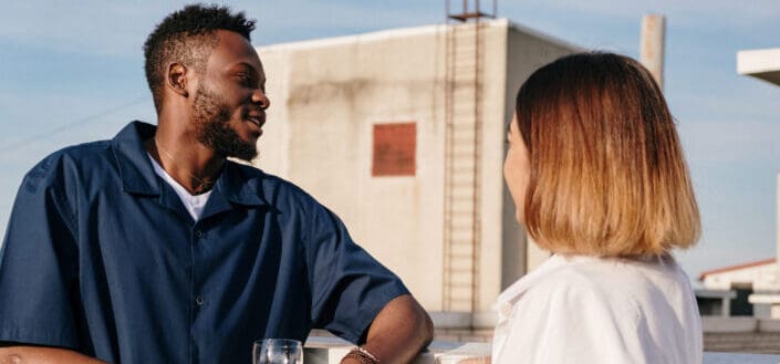 man and woman drinking wine