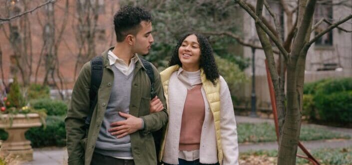 couple looking at each other while walking