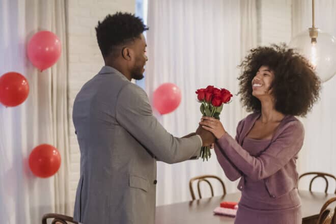 Happy valentine's day quotes - man giving flowers to woman