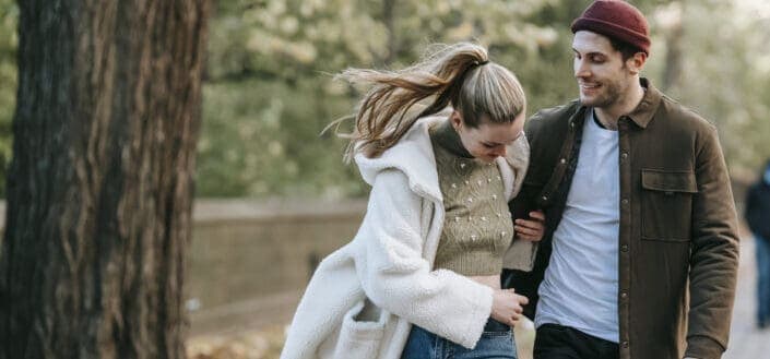 Young couple walking outside