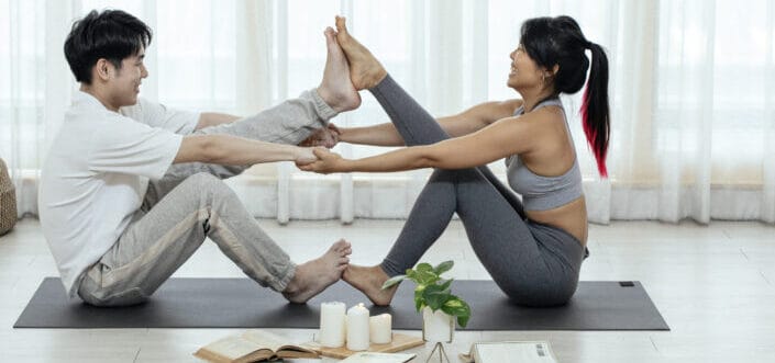 Couple doing indoor exercise together.