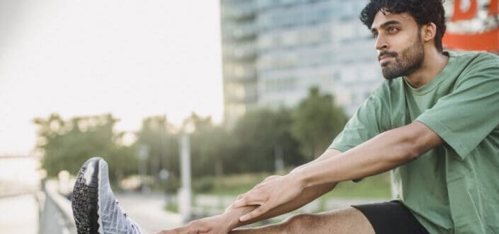 Man stretching outdoors.