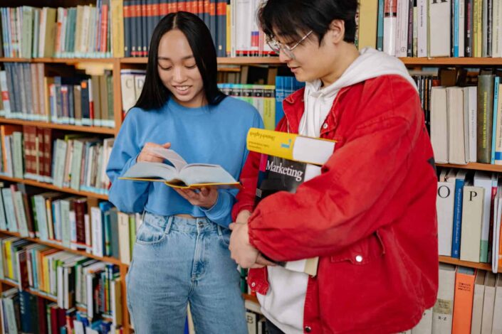 Man and Woman Talking Inside the Library