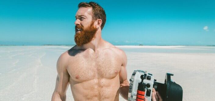 Man with a camera on a beach