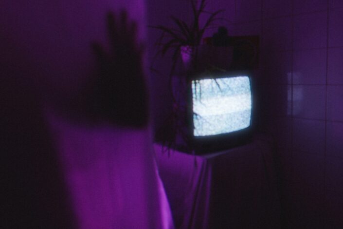 creepy old tv with a purple background
