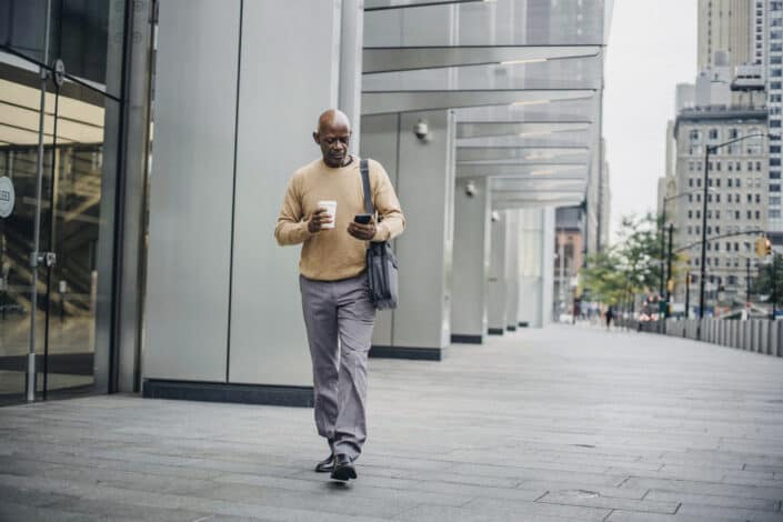 Man texting while walking.