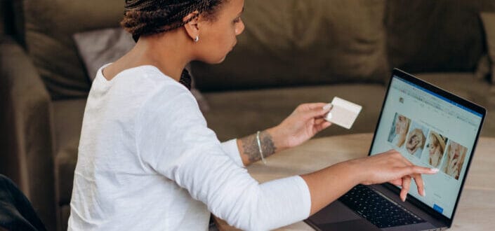 A young woman busy working on her laptop