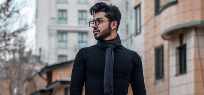 Young guy wearing eyeglass and turtle neck