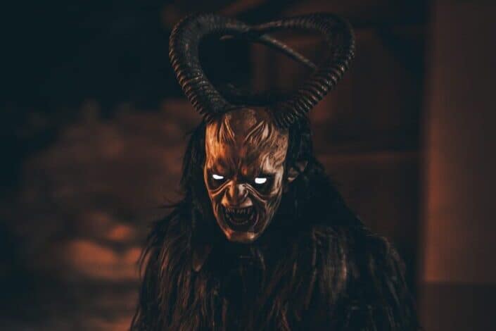 krampus demon with horns and creepy eyes