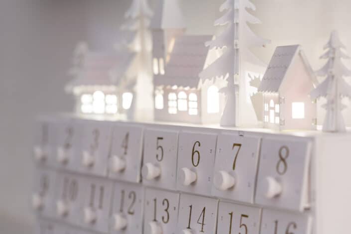 white Christmas calendar with mini houses