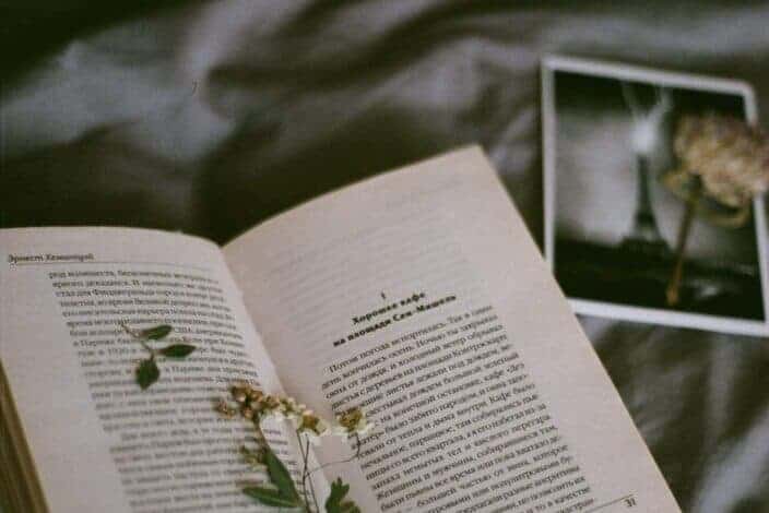 book with a clipped dried flower