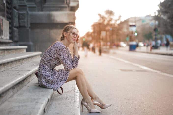 woman high heels sitting on the stairs case