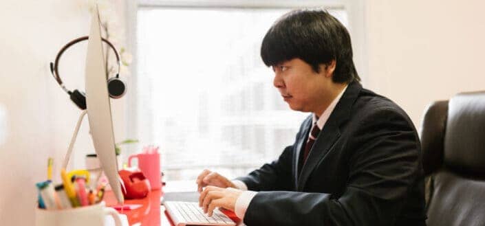 Man Using Desktop Computer at an Office