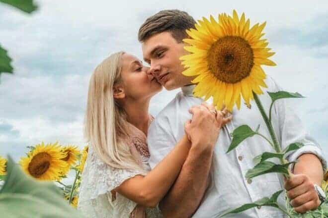 Couple on a date at a sunflower garden - what makes her think about you