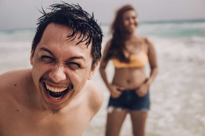 asian couple having fun at the beach