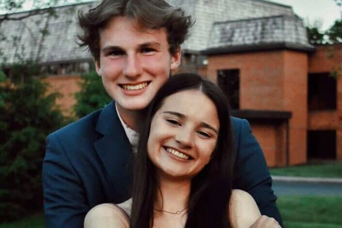 smiling young couple with formal attire