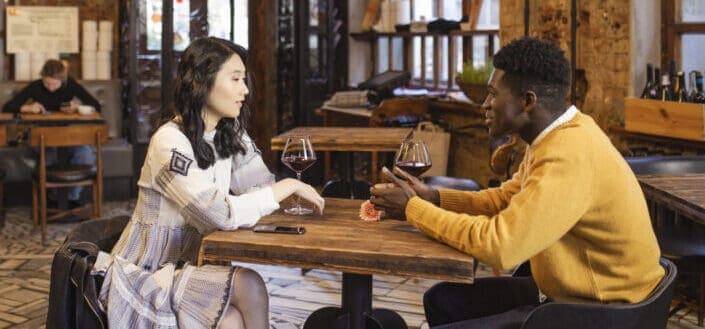 Couple drinking wine while having chat