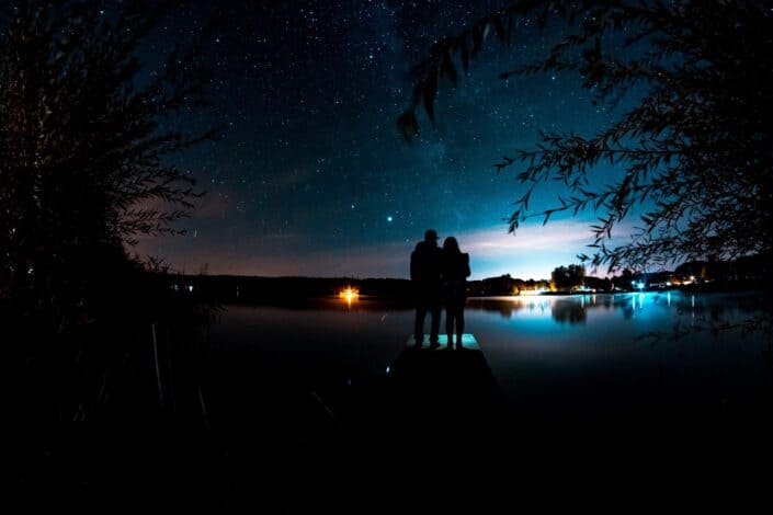 Couple clinging while watching the stars