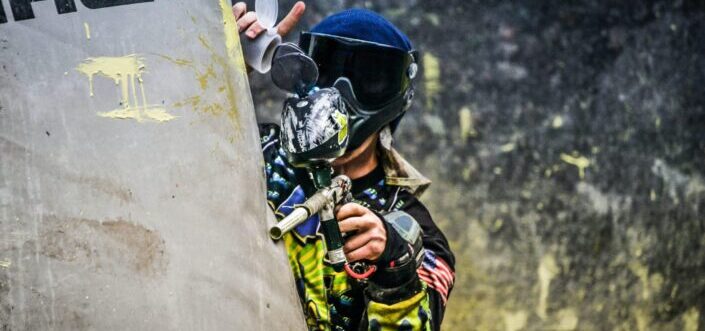 Guy getting ready for a paintball battle.