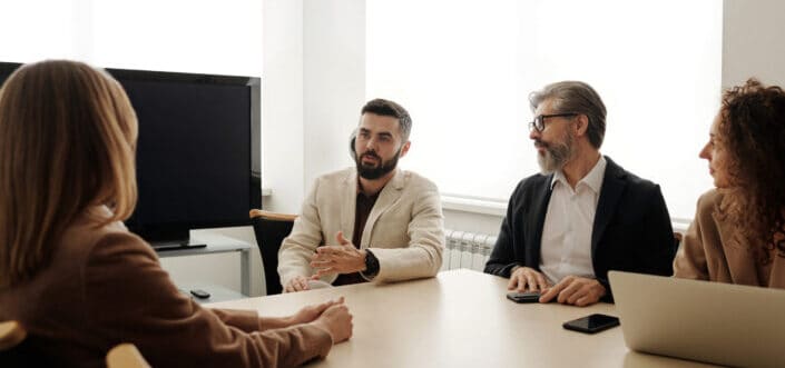 People discussing matters in a meeting