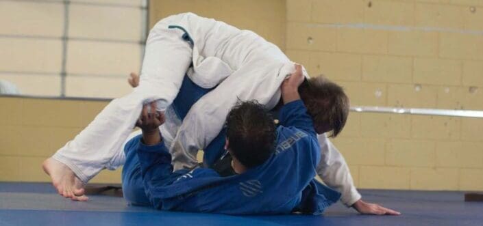 Two men battle up in a judo match.