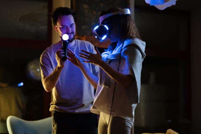 Man Teaching His Woman How VR XBOX Works