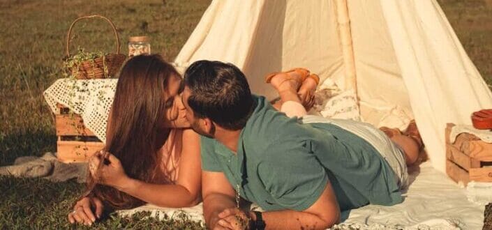 couple kissing inside a mini tent