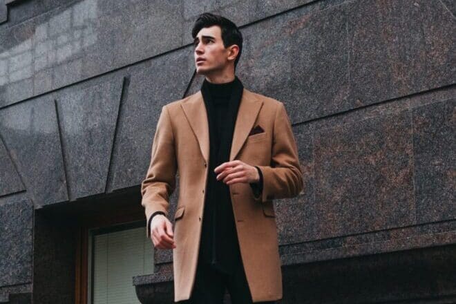 How to be a man - guy wearing brown suit jacket with black turtleneck shirt