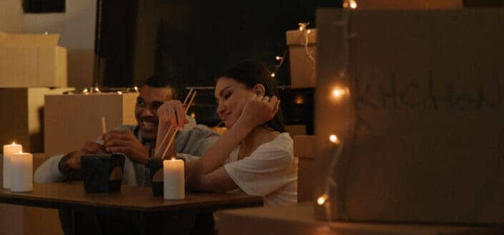 Couple Dating With Romantic Lights and Chinese Food