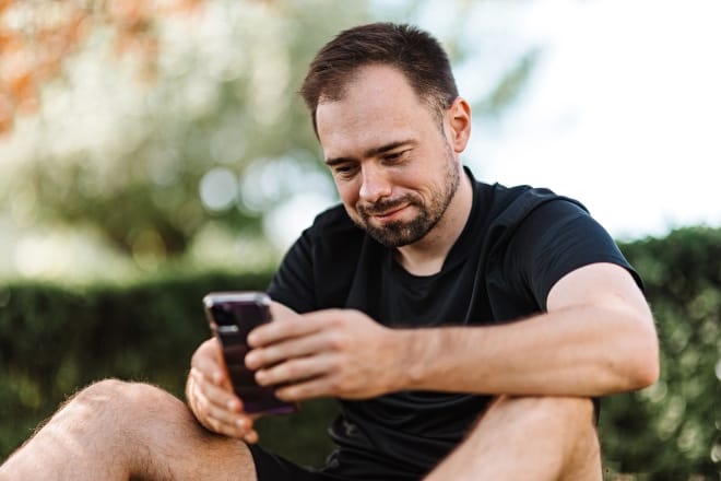 Man in Black Crew Neck T-shirt Using a Cellphone - How to text your crush