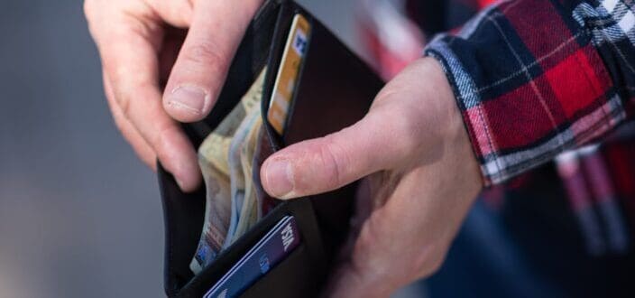 Hand opening a wallet