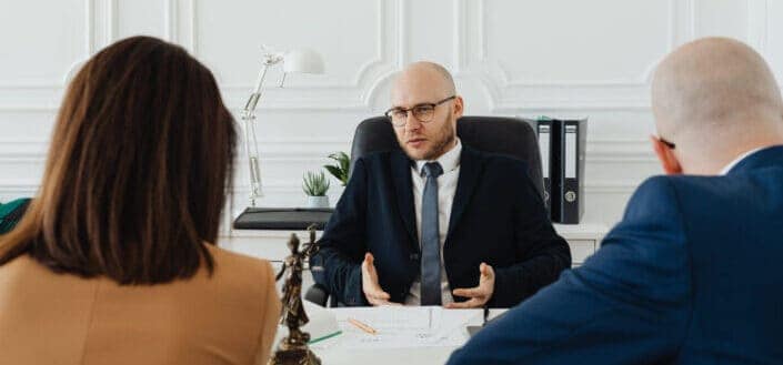 lawyer talking to a couple