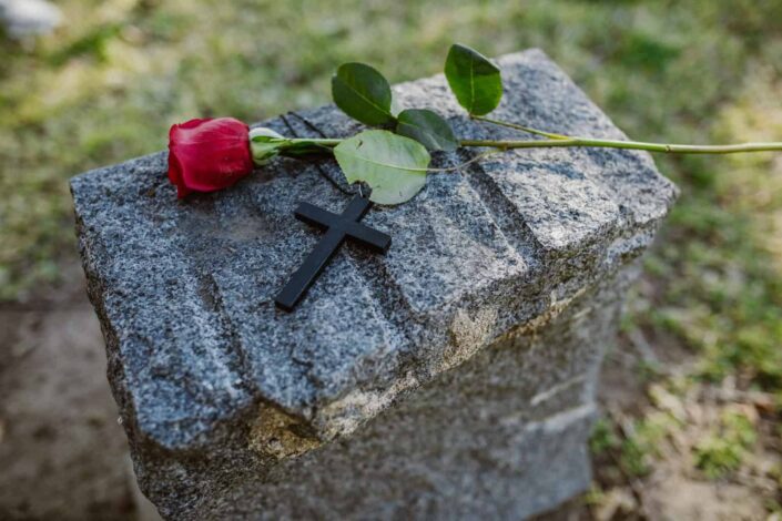 Rose And Cross On Top Of A Grave