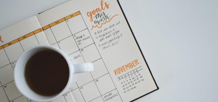 coffee on top of a planner 