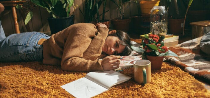 Woman Lying on Brown Textile