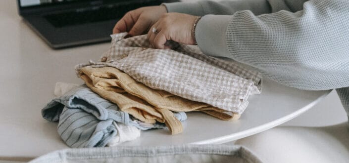 Mother folding her child's clothes