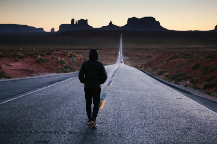 Man Jogging Alone on a Highway